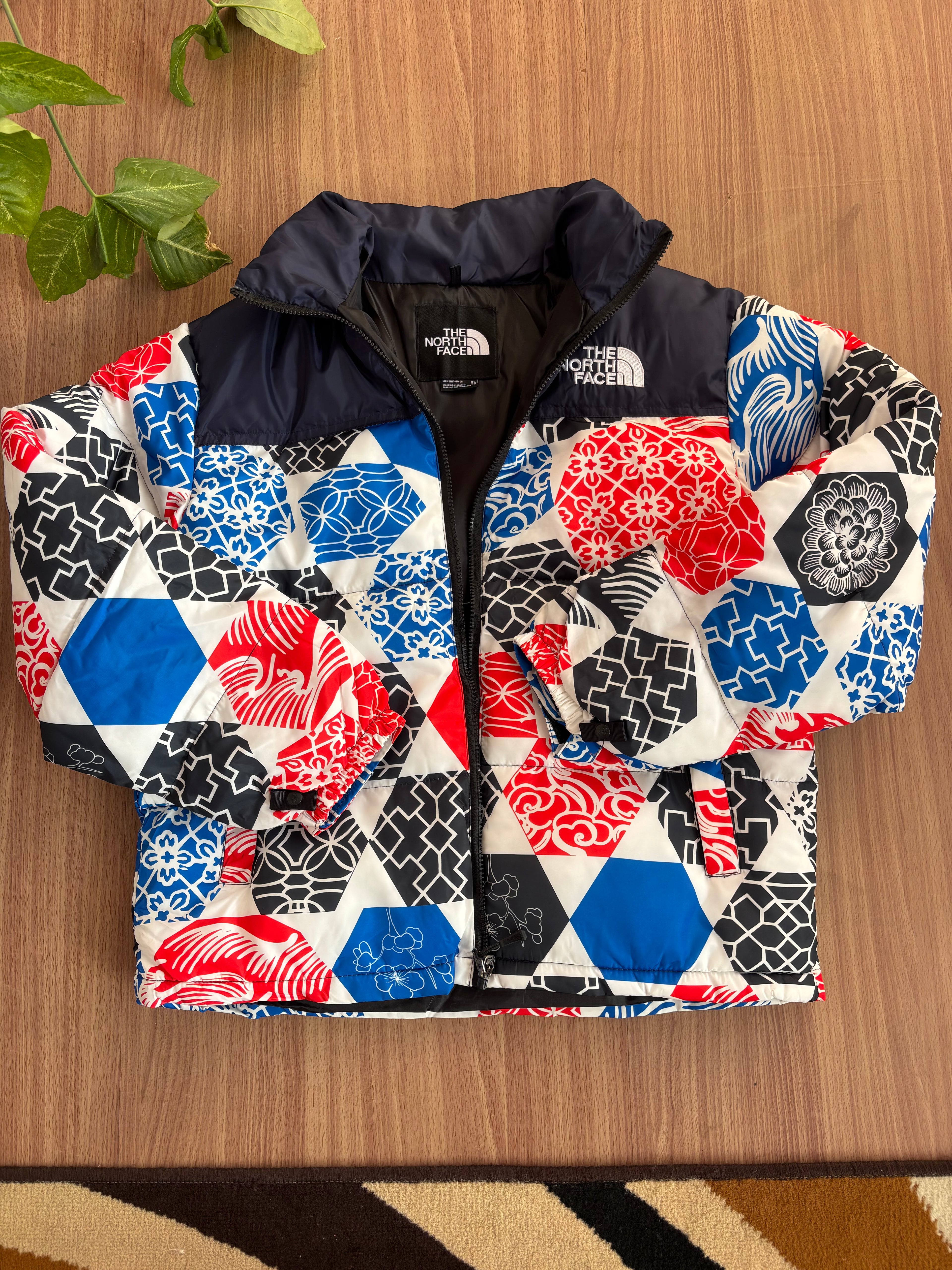 TNF 1996 Retro Nuptse Jacket in the Blue IC Geo Print