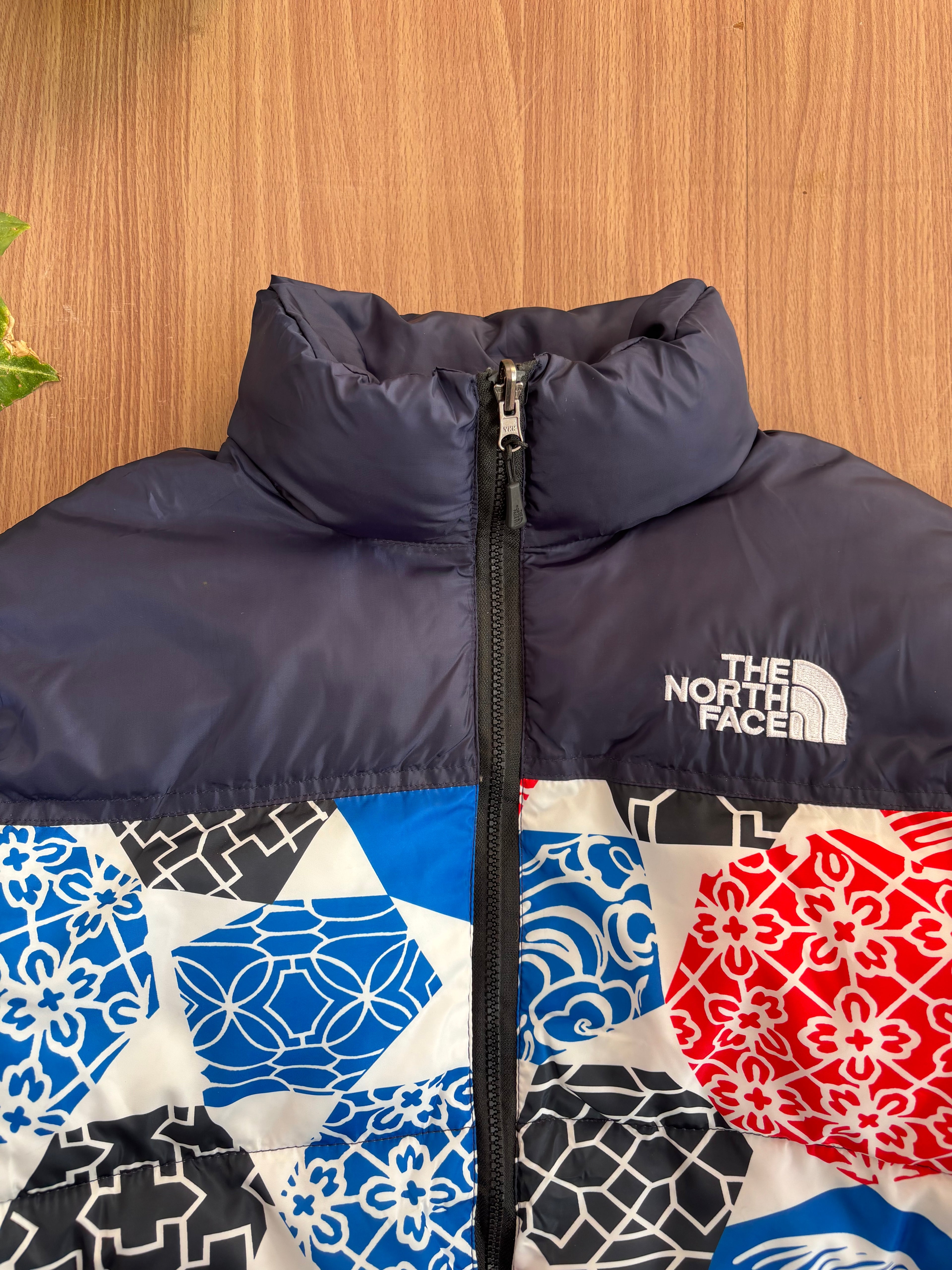 TNF 1996 Retro Nuptse Jacket in the Blue IC Geo Print