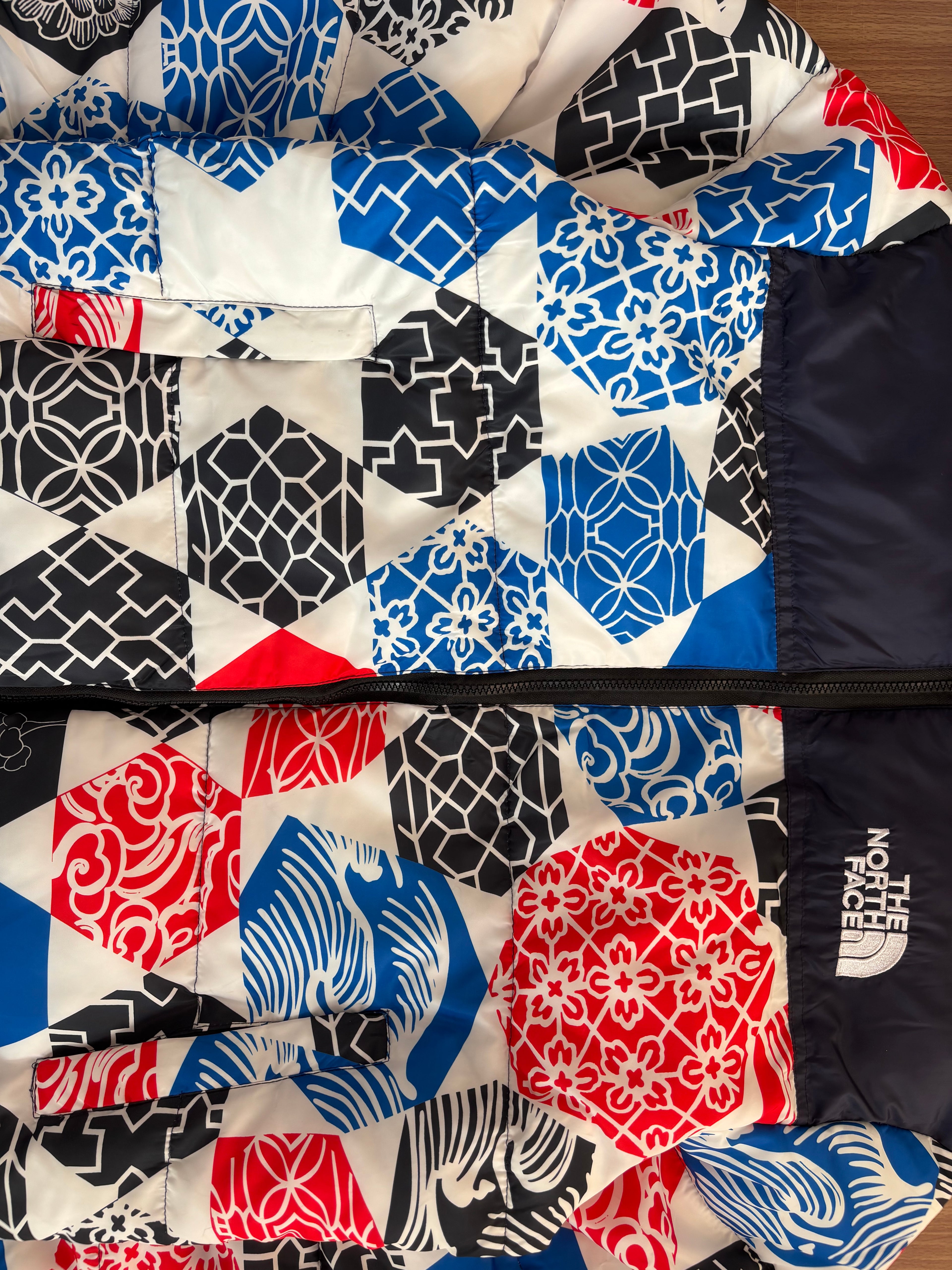 TNF 1996 Retro Nuptse Jacket in the Blue IC Geo Print