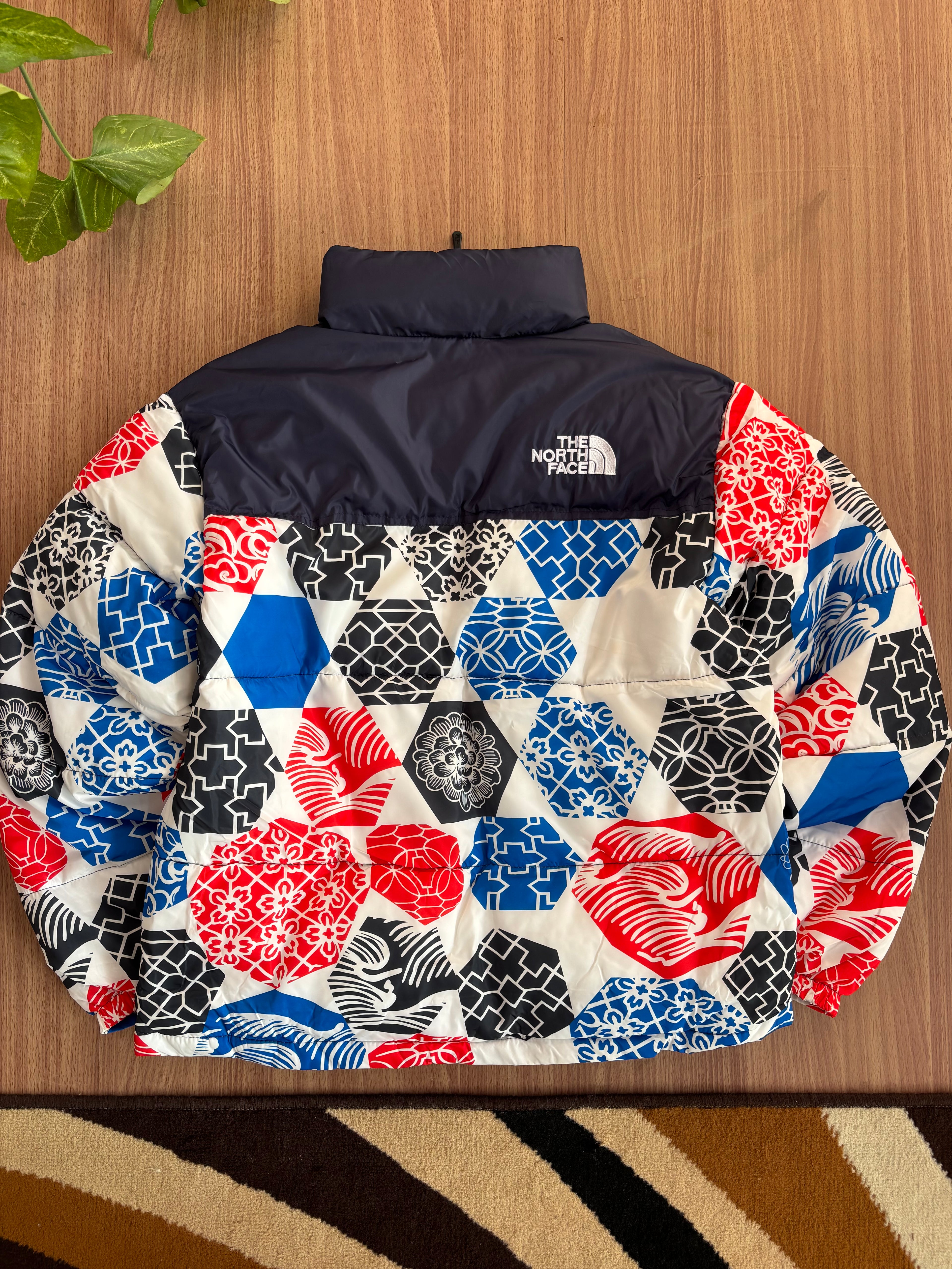 TNF 1996 Retro Nuptse Jacket in the Blue IC Geo Print
